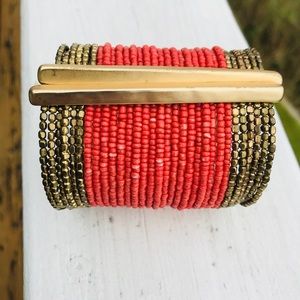Cuff bracelet, red beads and gold colored accents